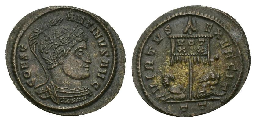 433   -  IMPERIO ROMANO. CONSTANTINO I. Follis. Ticinum (319-320). A/ Busto drapeado y con casco a der.; CONST-ANTINVS AVG. R/ Estandarte con VOT/XX flanqueado por dos cautivos; VIRTVS EXERCIT, exergo TT. AE 2,64 g. 20,7 mm. RIC-114. MBC+.