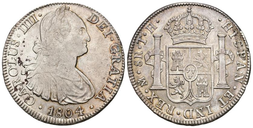 264   -  CARLOS IV. 8 reales. 1804. México. TH. AR 26,90 g. 39,8 mm. VI-802. Leves oxidaciones y hojita. R.B.O. MBC+/EBC-.