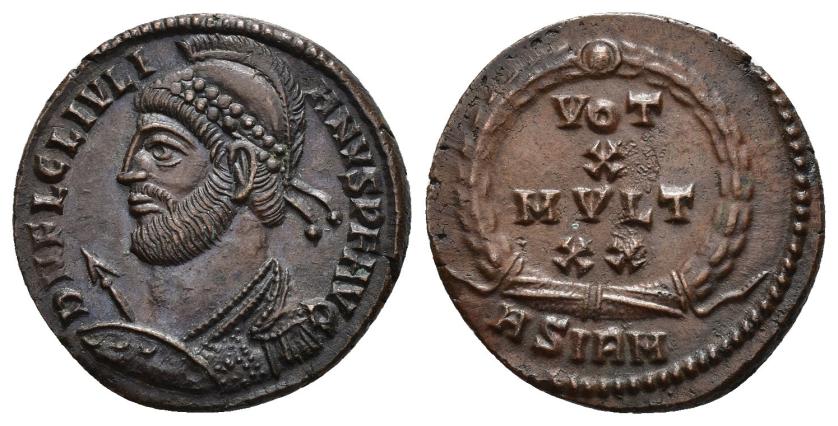 207   -  IMPERIO ROMANO. JULIANO. Follis. Sirmium (361-363). A/ Busto con casco, coraza, diademado, con lanza y escudo a izq.; D N FL CL IVLIANVS P F AVG. R/ VOT/X/MVLT/XX dentro de láurea. -/-//ASIQM. AE 3,27 g. 20,3 mm. RIC-108. EBC+. 