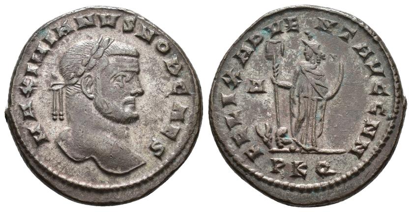 2411   -  IMPERIO ROMANO. GALERIO. Follis. Cartago (297). A/ Cabeza laureada a der.; MAXIMIANVS NOB CAES. R/ África a izq. con estandarte y colmillo, a sus pies toro y león; FELIX ADVEN AVGG NN. D/-//PKQ. AE 10,79 g. 26,9 mm. RIC-22b. MBC+.